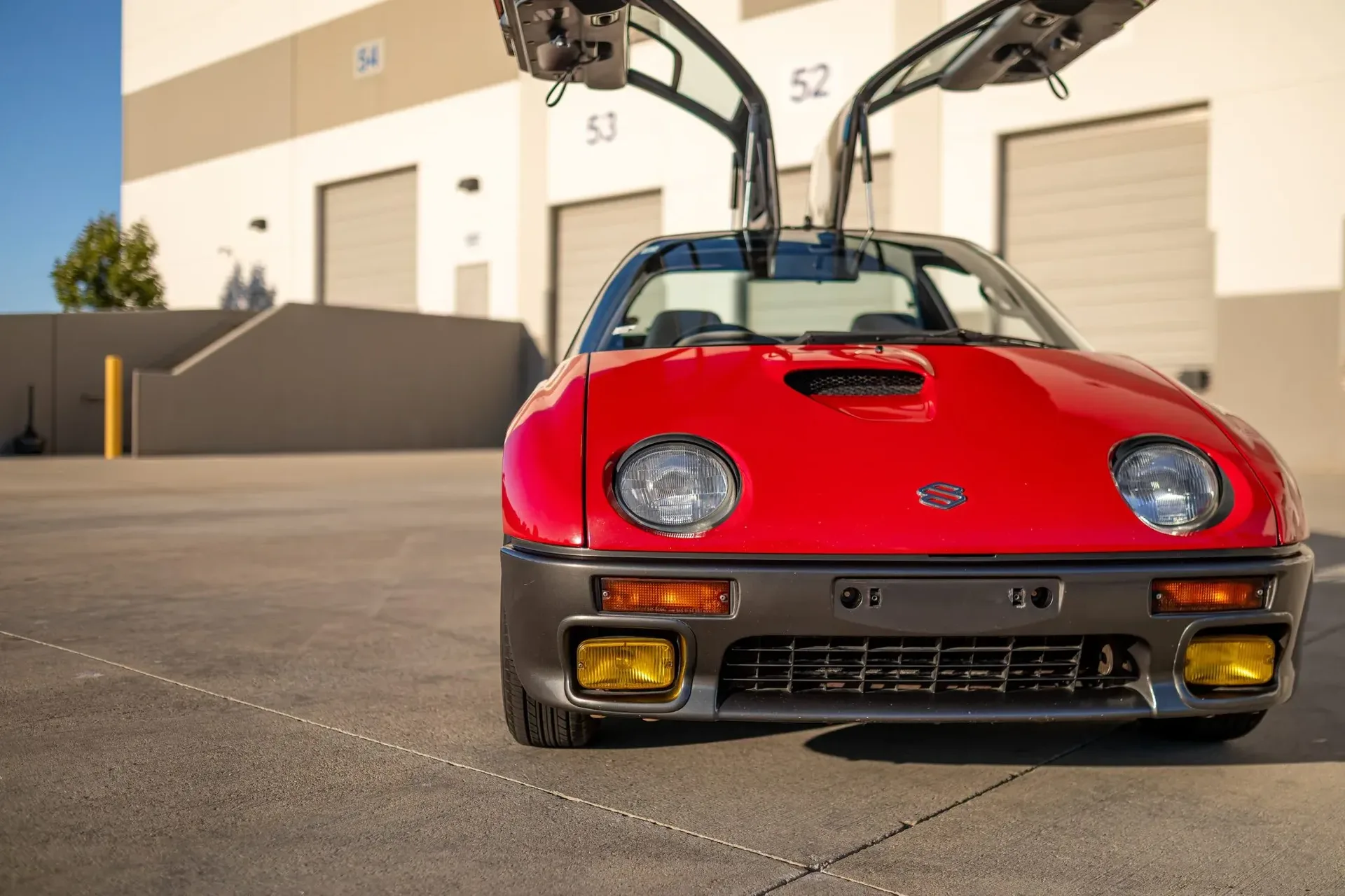 Suzuki’s pint-sized mid-engine supercar with gullwing doors packs just 64 HP
