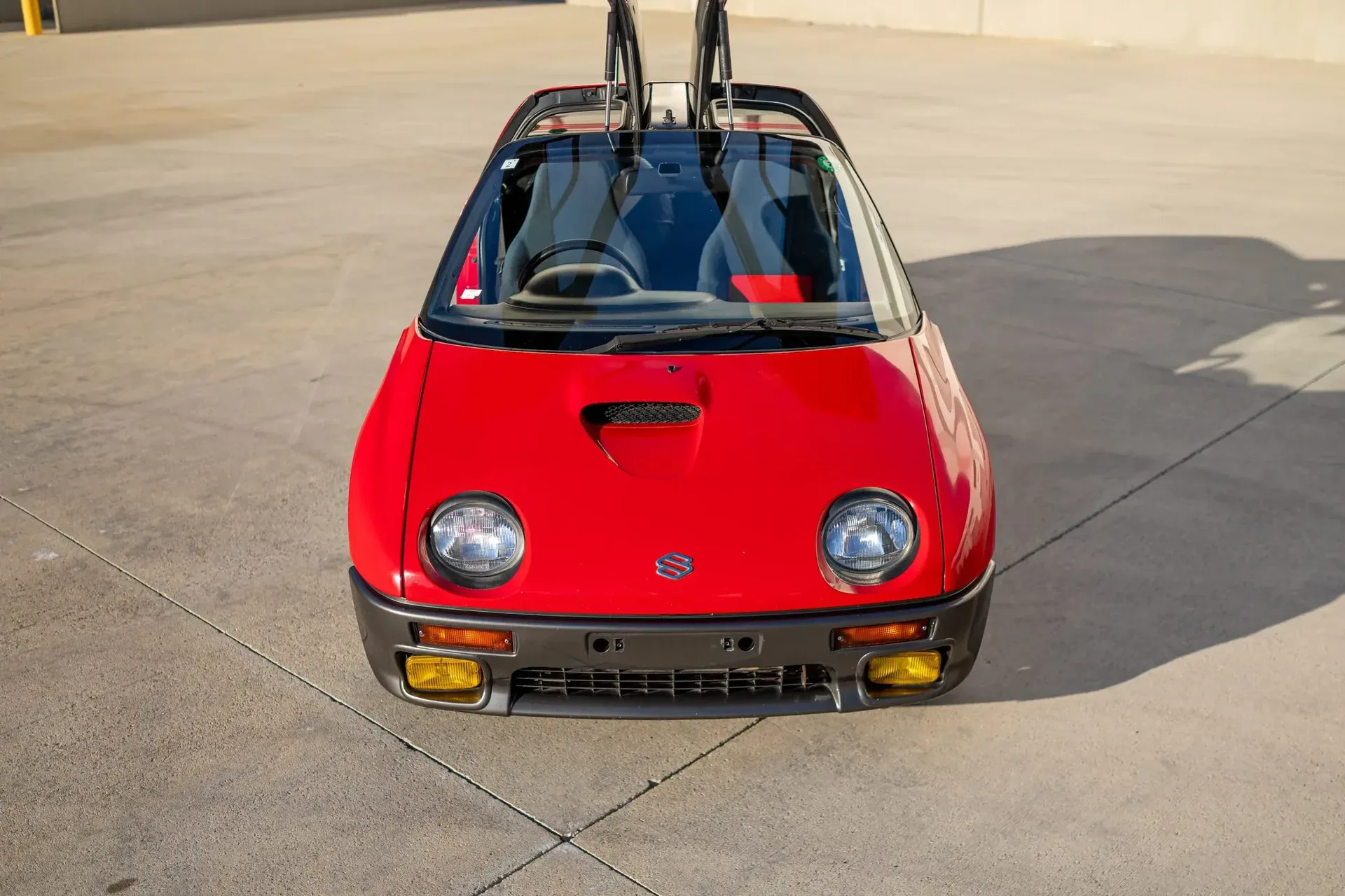 Suzuki’s pint-sized mid-engine supercar with gullwing doors packs just 64 HP